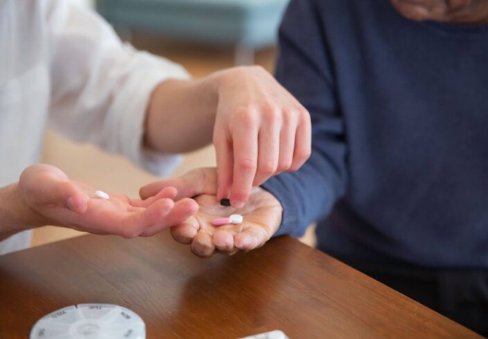 Carer helping with medication