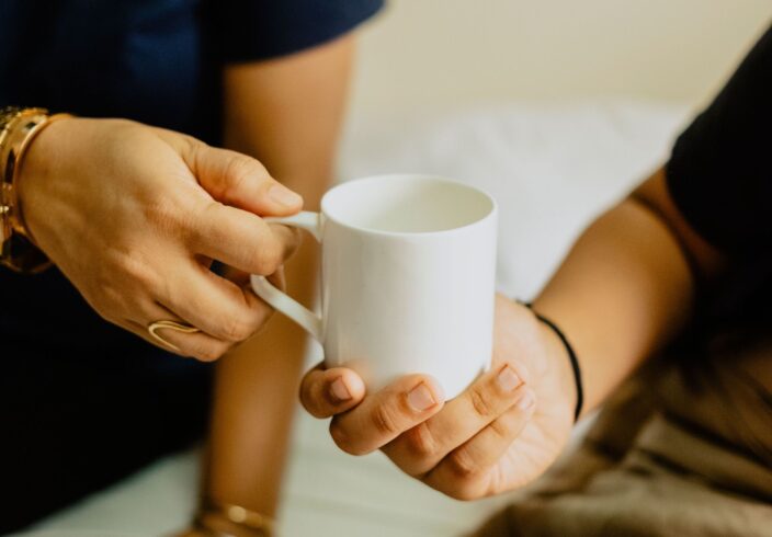 Handing someone a cup of tea